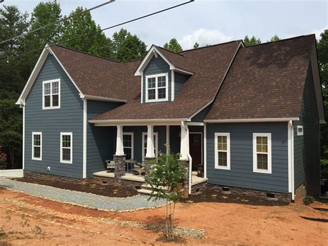 brown metal roof blue house|exterior house paint brown roof.